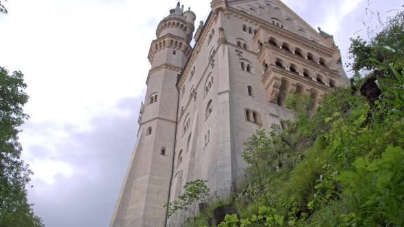Grandiose Construction of Neuschwanstein Castle in Bavaria. Shooting From Below. alt