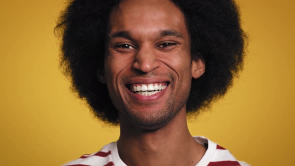 Close up video of facial expressions of young African man. Shot with RED helium camera in 8K. alt