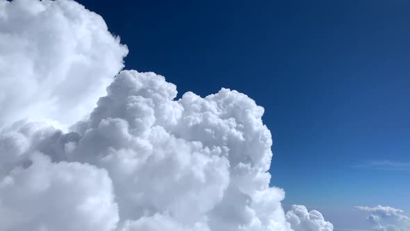 Spectacular White Clouds Build Up, Passenger View from Flying Aircraft alt