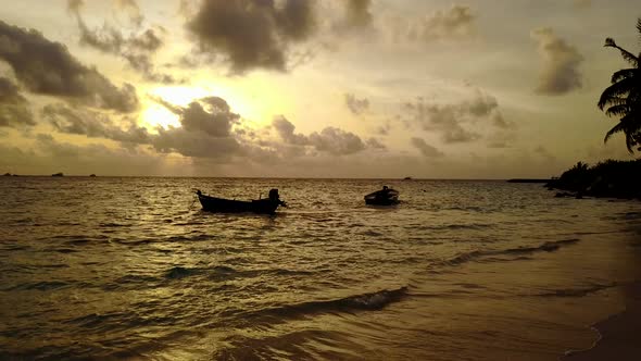 Wide overhead travel shot of a paradise sunny white sand beach and aqua blue ocean background  alt