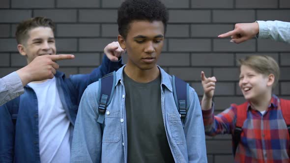 Mean Teenagers Pointing Fingers at Black Boy Crying, Verbal Bullying, Bad Rumors alt