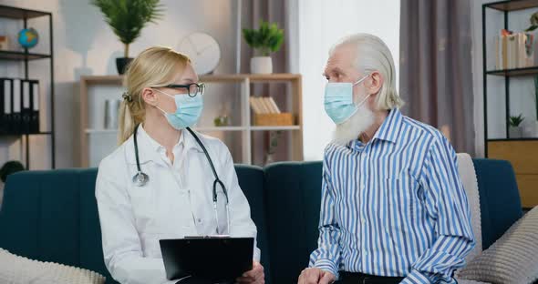 Bearded Man in Mask Talking with His Local Female Doctor and Telling About Well-Being alt