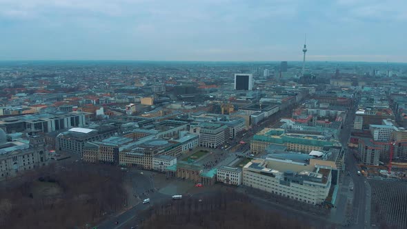 Aerial view of the Brandenburg Gate - Monument in Berlin Germany, Europe - Cloudy Day in 4K