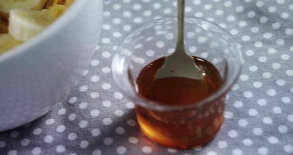 Bowl of corn flakes with banana 4k alt