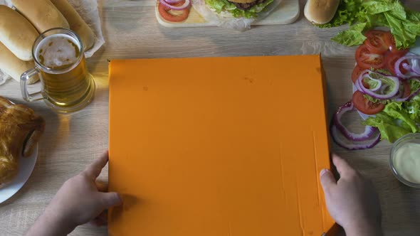 Man with Delight Looking at Big Fatty and Harmful Pizza, Unhealthy Lifestyle alt