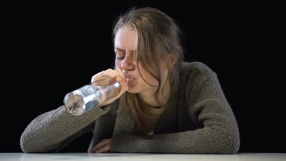 Alcoholic Woman Drinking Vodka, Domestic Violence Victim Trying to Forget Pain alt