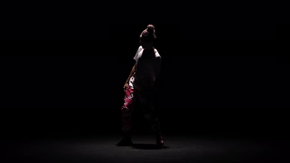Professional Young Hip-hop Dancer, Dancing in Dark Studio in the Fog. Hip Hop Culture. Rehearsal alt
