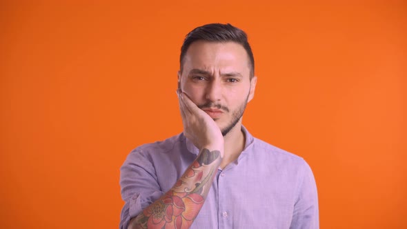 Young Man Suffering From Tooth Pain Ache. Dental Problem, Health Issues Concept alt