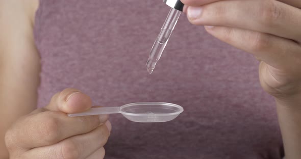 Medicine Drops for Colds Woman with Pipette Drops Syrup in a Spoon ...