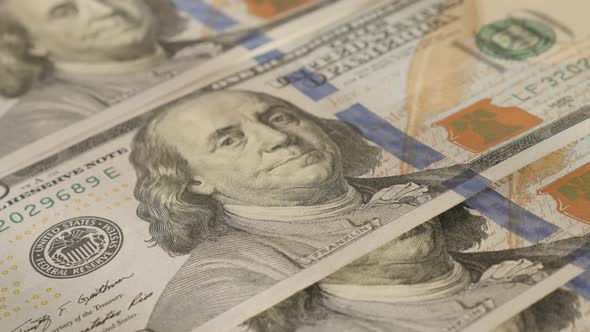 Lot of hundred dollar banknotes  close-up 4K 2160p 30fps UltraHD  tilting footage - USA  paper curre alt