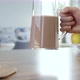 Taking And Putting Back Jug Of Chocolate Milk - VideoHive Item for Sale