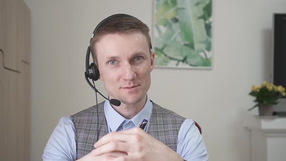 Young Businessman Communicates By Video Link alt