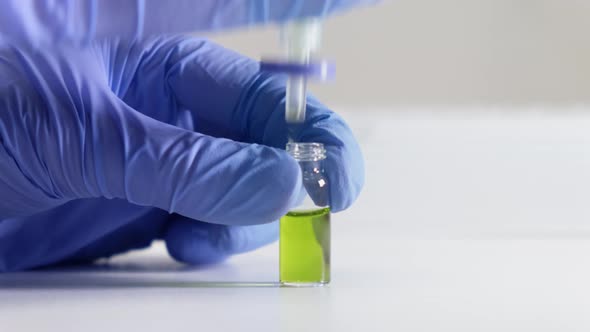 Scientist Filtering a Plant Sample Using Syringe Filter Before HPLC Analysis alt