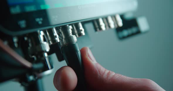 Video connector BNC SDI plug in close up slow motion 4K alt