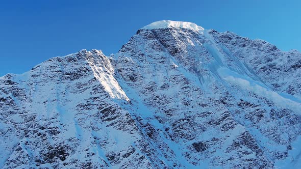 Picturesque Mountain Snowcapped Peak Under Clear Blue Sky alt