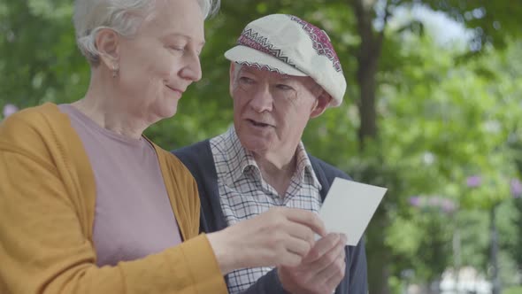 Portrait Adorable Adult Couple Looking Old Photos Remembering Happy Moments alt