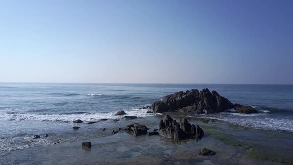 Endless Blue Ocean Waves Crashing at Pictorial Grey Rock alt