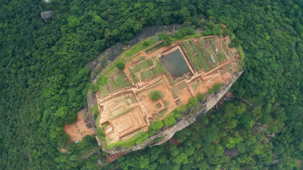 Aerial View of the Holy Mountain Sigiriya. Circling Around the Mountain Through the Clouds. Mountain