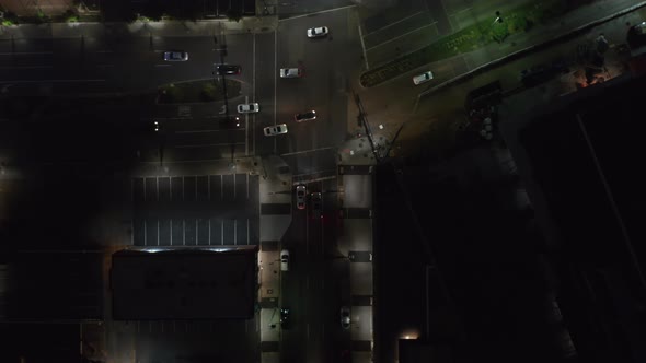 Aerial Birds Eye Overhead Top Down View of Cars Driving Through Intersection alt