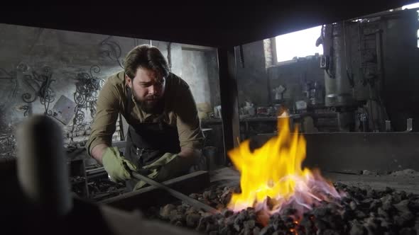 Blacksmith Checking Molten Billet alt