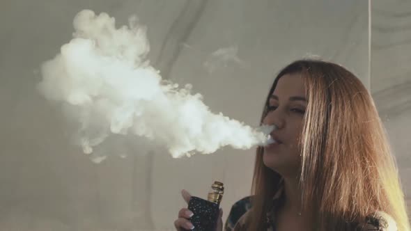 Macro Shot of Vaporing Dense Clouds of Smoke of Pretty Girl alt