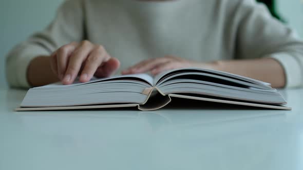 Closeup of a woman reading book