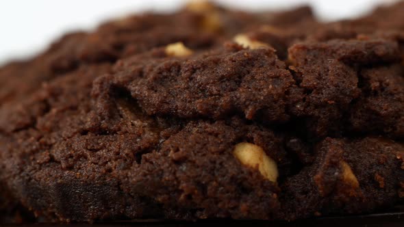 Slider close-up filming of chocolate chip cookies. Food biscuits close-up motion. alt