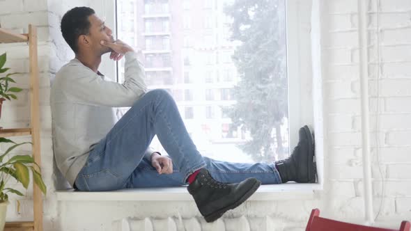 Thinking AfroAmerican Man Looking Through Window Brainstorming alt