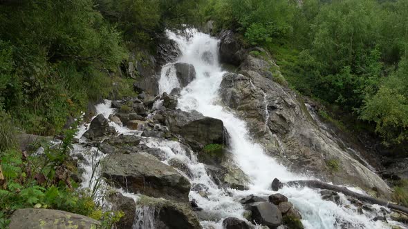 View waterfall scenes in mountains, national park Dombay, Caucasus, Russia