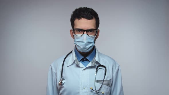 Arabic Doctor Face Looking to Camera and Nodding alt