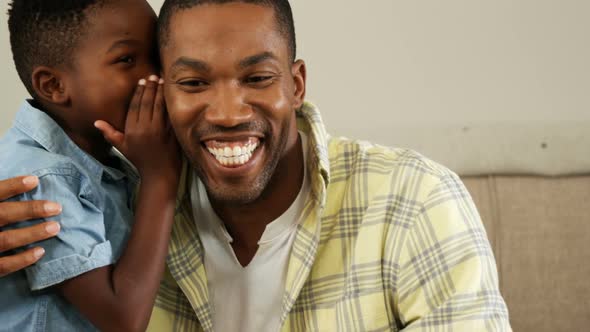 Son whispering in his fathers ear 4k alt