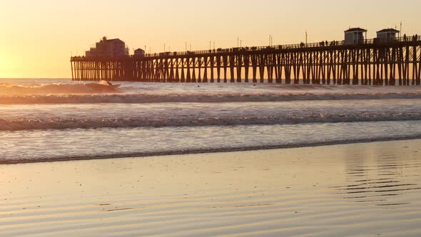 Wooden Pier on Piles Silhouette at Sunset California USA Oceanside