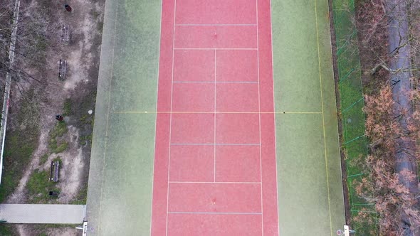Birdseye Aerial View of Empty Abandoned Tennis and Futsal Playground and Field alt