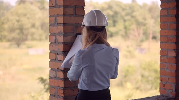 Civil Engineer Checking Construction Site. Woman Architect  Inspecting Real Estate Building. alt