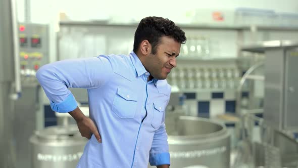 Male Employee Suffering From Back Ache at Work alt