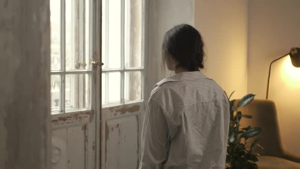 Unrecognizable Woman Window alt