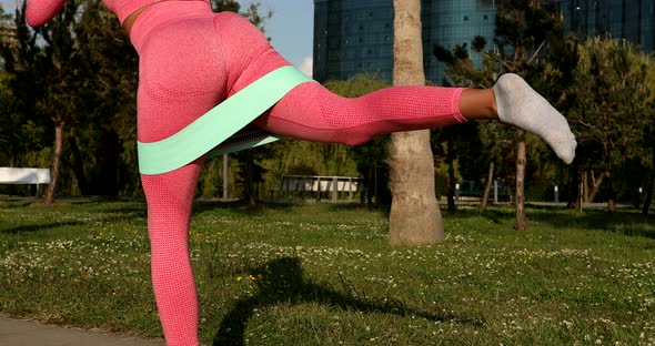 Close up of girl's legs and buttocks. Fitness, sport, exercising and lifestyle concept. alt