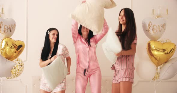 Three Friends with Long Dark Hair Smiles and Rejoices Together