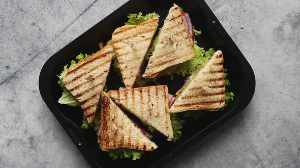 Appetizing Fresh Grilled Club Sandwiches with Ham and Cheese alt