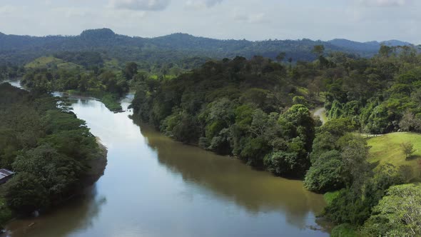 Aerial Drone View of Rainforest River and Mountains Scenery in Costa Rica at Boca Tapada, San Carlos alt