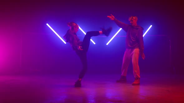 Trendy Dancers Battling Playfully in Freestyle Dance alt