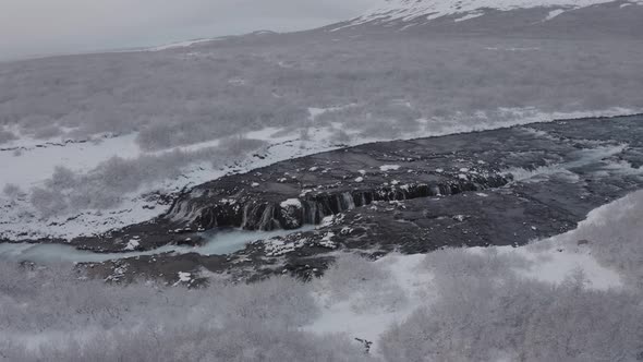 Aerial Drone Footage of Bruarfoss Waterfall in Iceland in Winter Season alt