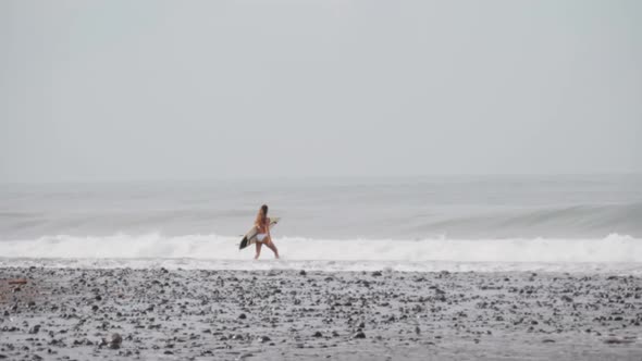 Sequence Of Woman Surfing Alone alt