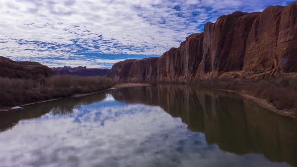 Colorado River and Red Sandstone Cliffs on Cloudy Day alt