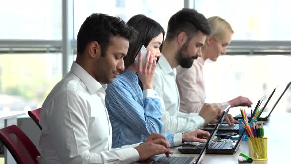 Asian Woman Start Talking on the Phone. alt