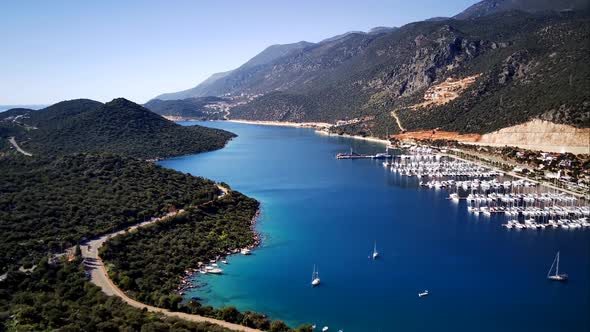 The top view from the drone of Kas resorts, bay with yahts and city in Mugla province of Turkey alt