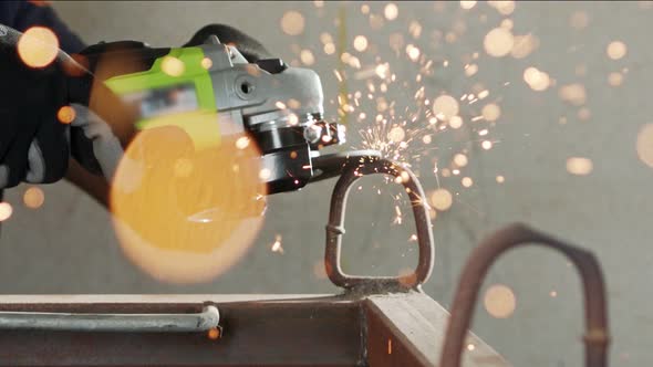 Slow motion of a metal grinder during work with sparks flying