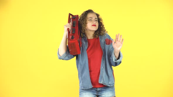 Girl Enjoying the Music and Dancing with the Red Boombox on Her Shoulder, Retro Style alt