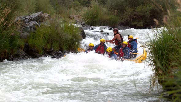 Super slow motion shot of group of people white water rafting, shot on Phantom Flex 4K