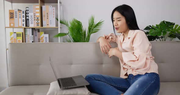 Woman  video call and sitting on couch alt